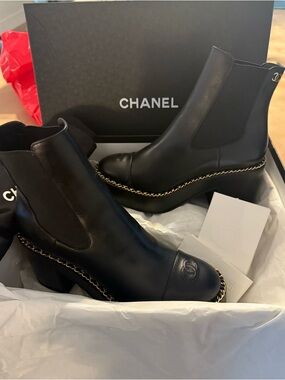 CHANEL Black Leather Chelsea Boots with Gold Chain Trim